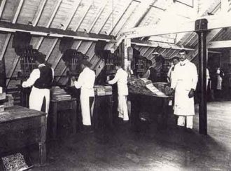 Men working machinery at the Greenbank chocolate factory