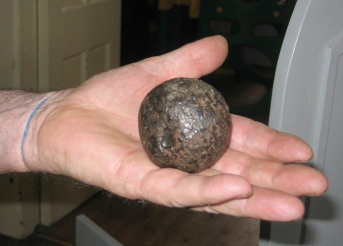 A canon ball brought into the Mini Market for identification