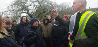Guide addressing group of listeners of heritage walk | 100 Homes Project