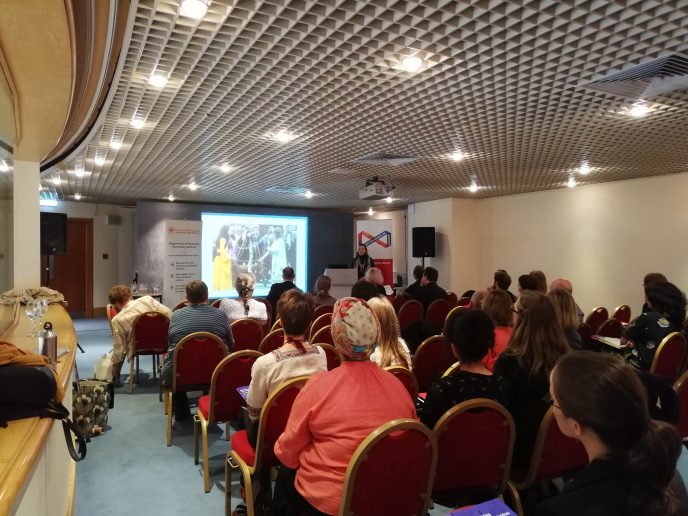 A breakout session at the CAHG 2019 Conference. A breakout session at the CAHG 2019 Conference. Rows of people are sat on chairs looking towards a Powerpoint screen. | Community Archives and Heritage Group