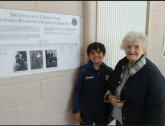 Kathleen Griffin of Moycullen attends the 2023 Genealogy Fair with her grandson Oran Sofeer of London showing him the Griffin family tree board.
