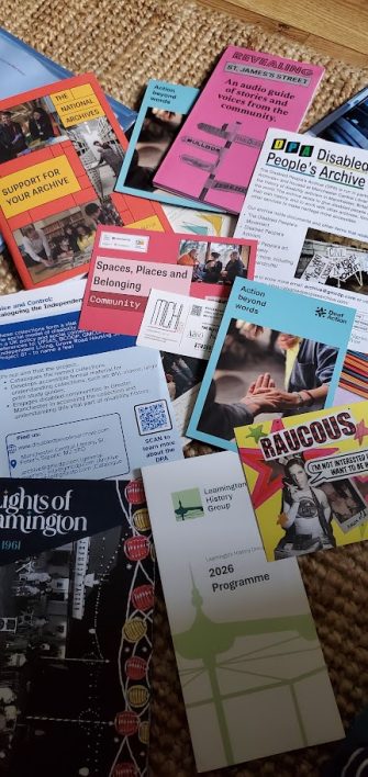 Posters from the CAHG 2026 conference Posters laid out on a table from the CAHG 2026 conference | Sally Lewis